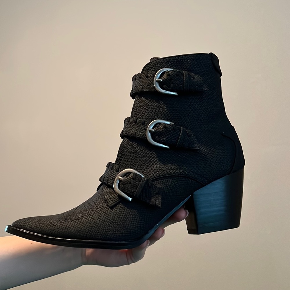 Black booties with silver buckles. Never been worn!